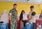 Babinsa Desa Benda Kawal Penyaluran Bantuan Beras untuk 214 KPM
